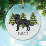 Schwarzer Labrador Retriever Winter Forest Individ Keramik Ornament<br><div class="desc">Desteis originelle Cartoon-Illustration eines niedlichen schwarzen Labrador Retriever Zuchthundes. Der Hund ist in einer Winterlandschaft mit drei grünen Tannenbäumen und fallendem Schnee untergebracht. Der Hintergrund ist ein blaues bis weißes Gefälle, das das Design des kalten Wintertages verleiht. Es gibt auch einen personalisierbaren Textbereich für einen Namen oder einen anderen benutzerdefinierten...</div>