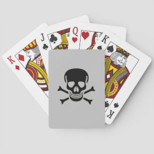 Schwarzer Schädelgrauer Poker, der Karten spielt Spielkarten