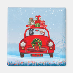 Schwarzer Schäferhund in Auto mit dem Weihnachtsma Magnet