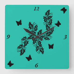 Schwarzer Schmetterling auf Grün Quadratische Wanduhr