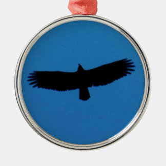 Schwarzer Vogel in einem blauen Himmel Silbernes Ornament