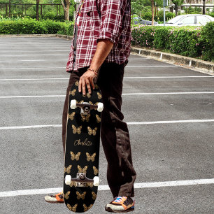 Schwarzes Goldbutterfliegenmuster Skateboard