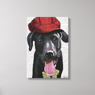 Schwarzes Labrador mit roter Kappe Leinwanddruck