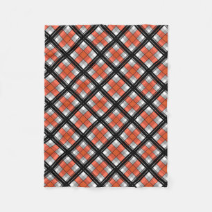 Schwarzes und orange kariertes fleecedecke