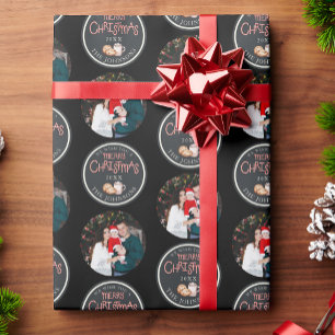 Schwarzes Weihnachtsbuch mit einer Meldung zum Fot Geschenkpapier