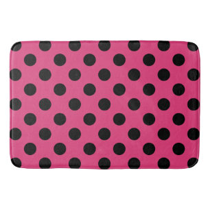 Schwarzpolka-Punkte auf Fuchsia Badematte