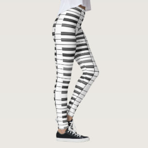 Schwarzweiss-Klavier befestigt Leggings