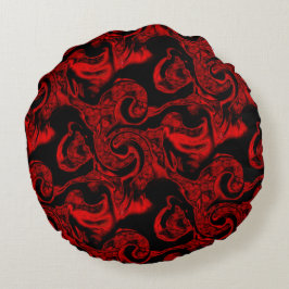 Sehr farbige rote Spiralteile auf schwarzem Hinter Rundes Kissen
