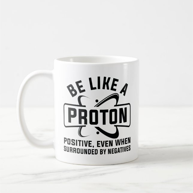 Sei wie ein Proton Kaffeetasse (Links)