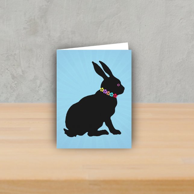Seitenprofil Schwarze Kaninchen Blume Rosa Auge si Karte (Black silhouette sitting rabbit wearing colourful flowers on Spring or Easter blue note card.)