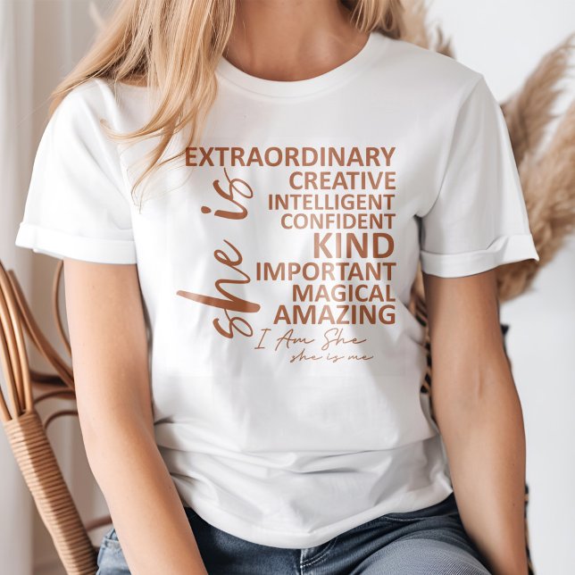 "She is Me" Mocha Mousse Affirmation Typografy T-Shirt (Young blond woman wearing a "She is Me" Mocha Mousse Affirmation Typography T-Shirt.)