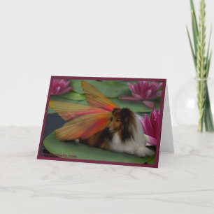 Sheltie Fee auf einer Lilien-Auflage. w-Grenzepsd Karte