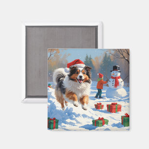 Shetland Sheepdog läuft durch Schnee mit Weihnacht Magnet