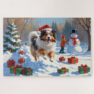 Shetland Sheepdog läuft durch Schnee mit Weihnacht Puzzle