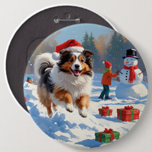 Shetland Sheepdog läuft Schnee mit Weihnachtshut Button