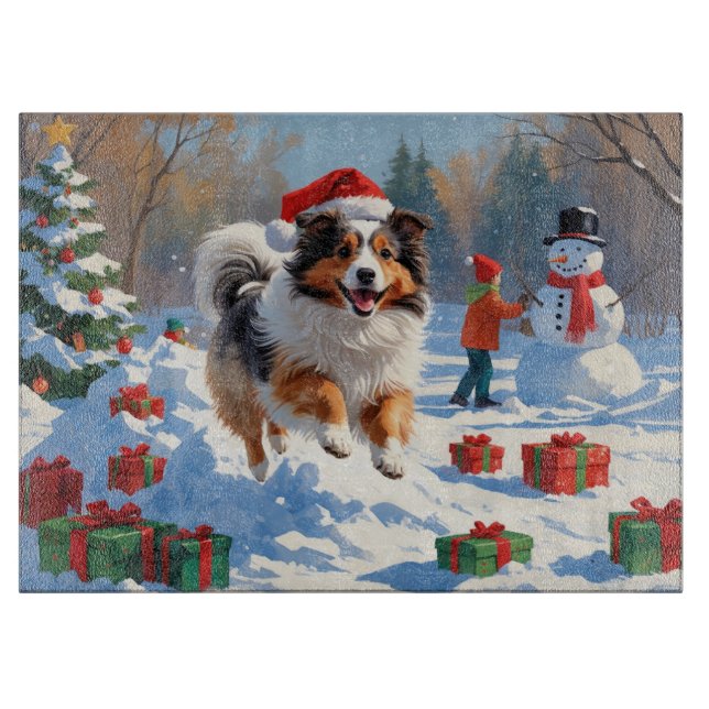 Shetland Sheepdog läuft Schnee mit Weihnachtshut Schneidebrett (Vorderseite)