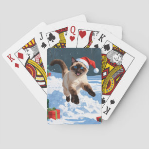 Siamese-Katze läuft im Schnee mit Weihnachtsmütze Spielkarten