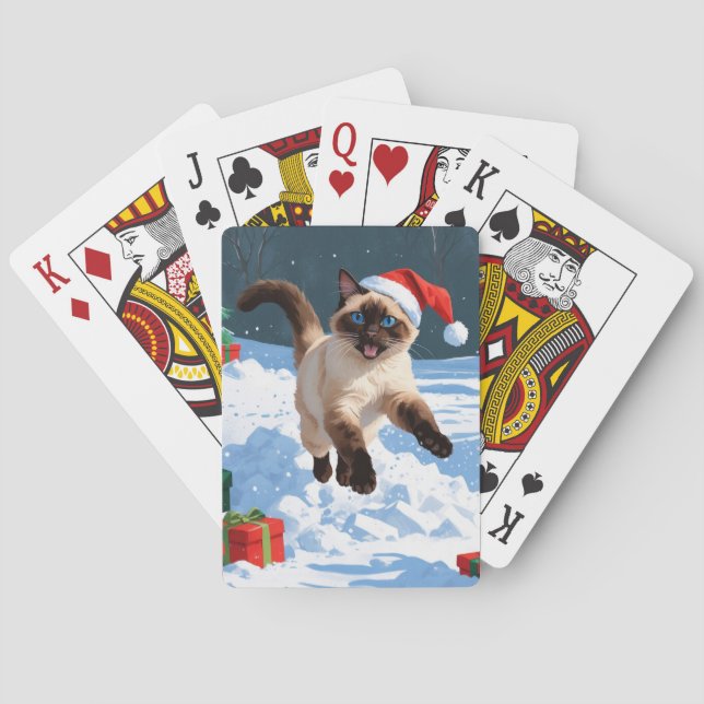 Siamische Katze läuft im Schnee mit Weihnachtsmütz Spielkarten (Rückseite)