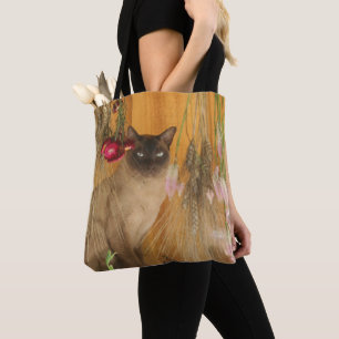 Siamkatze mit Blume