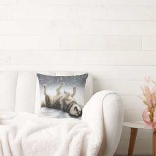 Sibirischer Husky schafft einen Schneengel Kissen