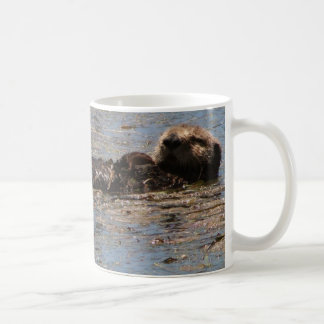 Sie Otter sind in den Bildern Kaffeetasse