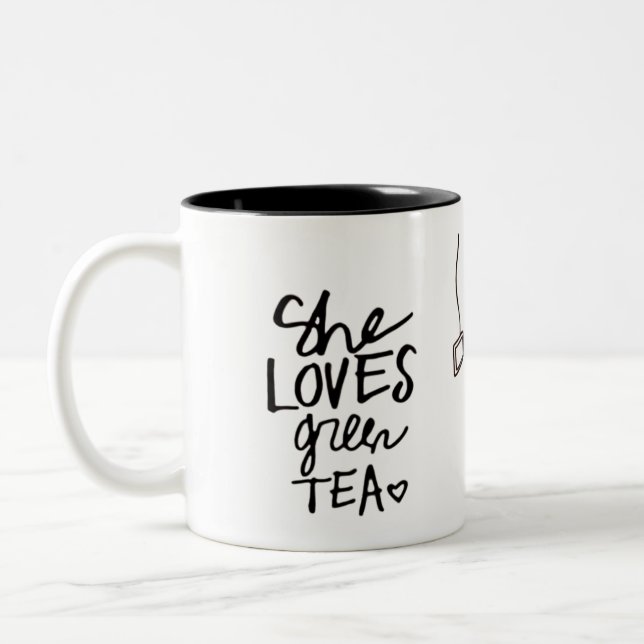 sie Tasse des grünen Tees der Lieben (Links)