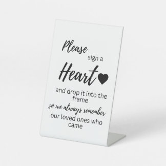 Signieren eines Herzsignatars Sockelschild