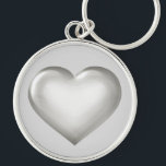 Silberglasplatte Schlüsselanhänger<br><div class="desc">Diese Schlüsselkette weist ein formschönes silbernes Herz mit einem gläsernen Aussehen auf.</div>