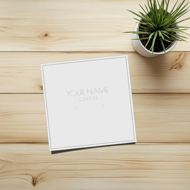 Silbergrenzenehmer (Square white earring display card with thin silver grey border and text)