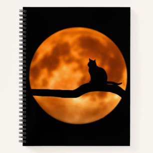 Silhouette einer schwarzen Katze in einem Baum Notizbuch