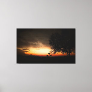 Silhouette eines Baumes bei Sonnenuntergang Leinwanddruck