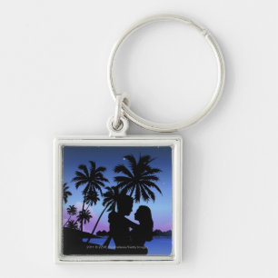 Silhouette eines Paares, das auf dem Strand umfaß Schlüsselanhänger