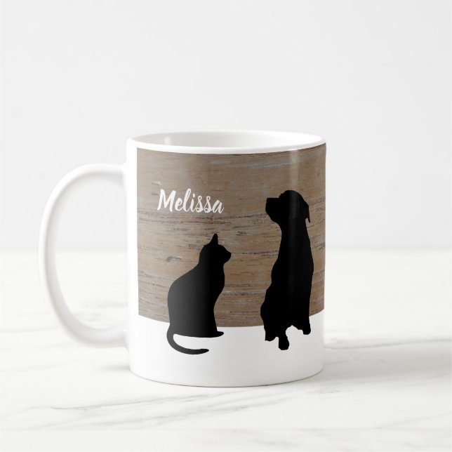 Silhouetten der schwarzen Katze Hundeauf hölzernem Kaffeetasse (Links)