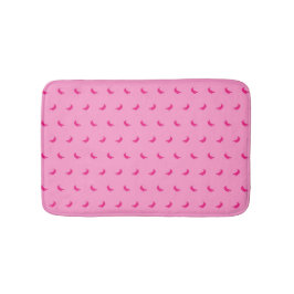 Silhouetten kleiner rosafarbener Bananen in Rosa Badematte
