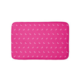 Silhouetten von kleinen rosa Bananen auf intensiv Badematte