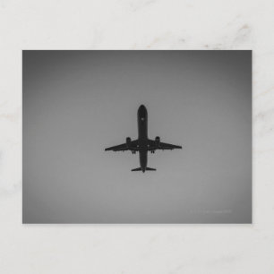 Silhouettierte Flugzeuglandung Postkarte