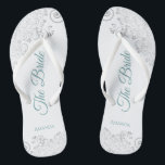 Silver Lace & Aquamarin auf White The Bride Weddin Flip Flops<br><div class="desc">Tanzen Sie die Nacht mit diesen schönen Hochzeitsflip-Flops. Sie sind für die Braut konzipiert und zeichnen sich durch ein schlichtes und elegantes Design aus, das mit aquamarinen oder türkisfarbenen Schriftzeichen auf weißem Hintergrund und extravaganten silbergrauen Spitzen-Gürteln und Wirbel versehen ist. Eine schöne Art, extravagant und angemessen bleibe, während Sie Ihren...</div>