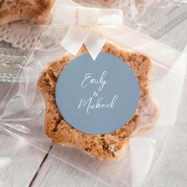 Simple Elegant Dusty Blue Script Minimal Wedding Runder Aufkleber (Simple and elegant, minimal white calligraphy script on a dusty blue background)