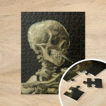 Skeleton with a Burning Cigarette | Van Gogh Puzzle<br><div class="desc">Skull of a Skeleton with Burning Cigarette (1886) by Dutch post-impressionist artist Vincent Van Gogh. Original painting is an oil on canvas, most likely from Van Gogh's short-lived period of drawing courses at the Academy of Art in Antwerp. The burning cigarette was probably intended as a joke, perhaps as a...</div>