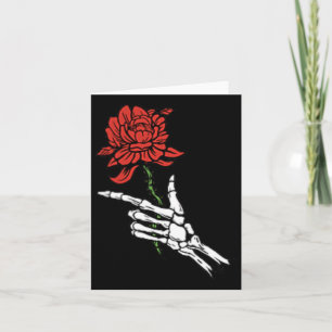 Skeletthand mit einer Rote Rose Karte