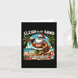 Sleigh auf dem Sand mit Kokosnuss in der Hand Chri Karte