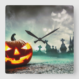 SlipperyJoe's leuchtender Kürbis-Halloween-Wa Quadratische Wanduhr