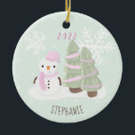 Snowman Christmas Keramik Ornament<br><div class="desc">Snowman Christmas Celebrate your child's winter birthday with this cute and snowman wearing a pastel pink knitted hat and scarf. This theme is ideal for your little one’s winter birthday or kid’s Christmas party. Design is completely customizable. Check out the coordinating stationery and ohrs.</div>