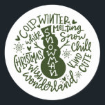 Snowman Christmas Winter Wonderland Typografie Runder Aufkleber<br><div class="desc">Eine festliche typografische Komposition von handgeschriebenem Weihnachtszitat (Schneekill, Steinglocken, Kalter Winter, Weiße Weihnachten, Wunderland, Weihnachtswunsch) umkreist einen Schneemann mit kleinen Herzen und Schneeflocken. Ideal, um Weihnachts- und Feiertagsbriefe und Weihnachtskarten zu Siegel oder Ihre Geschenke unter dem Weihnachtsbaum zu schmücken! Forest Green Farbe ist vollständig veränderbar, auch die Farbe Weiß ist...</div>