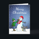 Snowman Gebäude Feiertagskarte<br><div class="desc">Der Junge hat einen Schneemann gebaut,  auf dem sein Hund steht und uriniert,  während der Junge dem Schneemann eine Karottennaase gibt.</div>