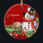Snowman Top Hat - Baby Keepake Personalisiert Keramik Ornament<br><div class="desc">Mit dem Snowman-Ornament Lächeln lassen Sie Ihre Feriendekorationen mit wahrem Charme verzaubern! Dieses festliche Design besticht durch einen zauberhaften Wasserfarbenschneemann, der einen klassischen schwarzen Hut mit rotem Band und heilige Blätter mit Beeren trägt. Sein fröhlicher, roter Muffler, sein Gesenkkörper und sein warmes Lächeln sind umgeben von einer schönen Anordnung von...</div>