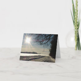 Snowy Country Road mit Sonnenschein Feiertagskarte