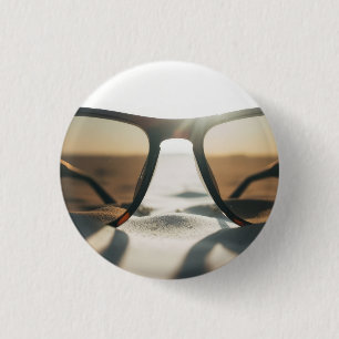 Sonnenbrille auf Sand Button