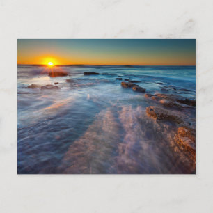 Sonnenstrahlen erhellen den Pazifischen Ozean Postkarte