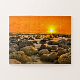Sonnenuntergang am Felsstrand Puzzle